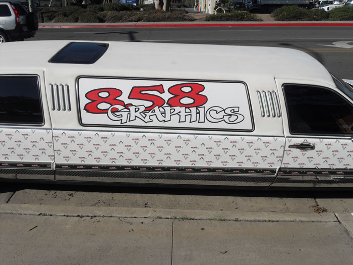 Limo wrapped with 858 Graphics branding, featuring a step and repeat pattern, showcasing innovative advertising solutions for mobile marketing.
