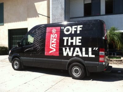 Vans branded van showcasing "OFF THE WALL" slogan, demonstrating effective vehicle graphics for marketing by 858 Graphics.