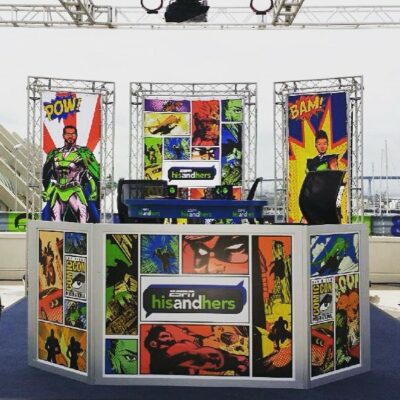 Colorful ESPN studio set design featuring comic book graphics and vibrant superhero themes, promoting the "His and Hers" show.