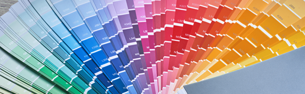 Color swatches in a fan layout showcasing a variety of hues for yard sign printing options by 858 Graphics Inc.