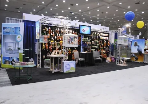 Expert signage installation team at a trade show, showcasing efficient booth setup